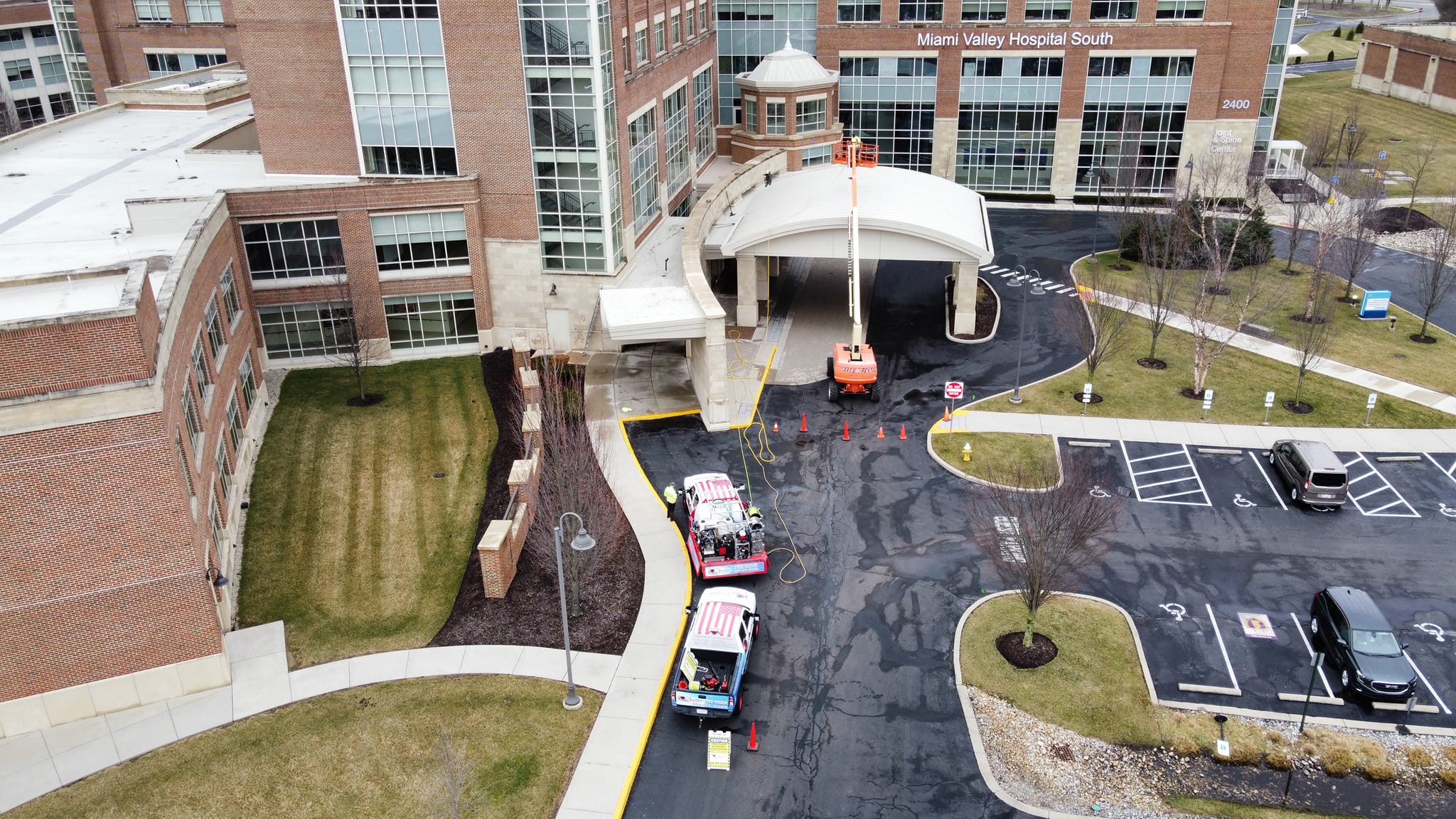 Commercial concrete cleaning result showing brighter cleaned surface and improved curb appeal