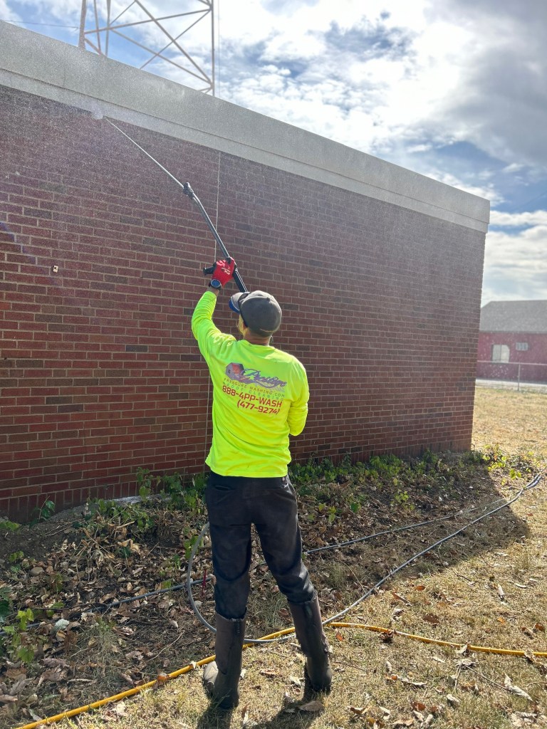 Prestige Pressure Washing Trusted Tech spraying brick