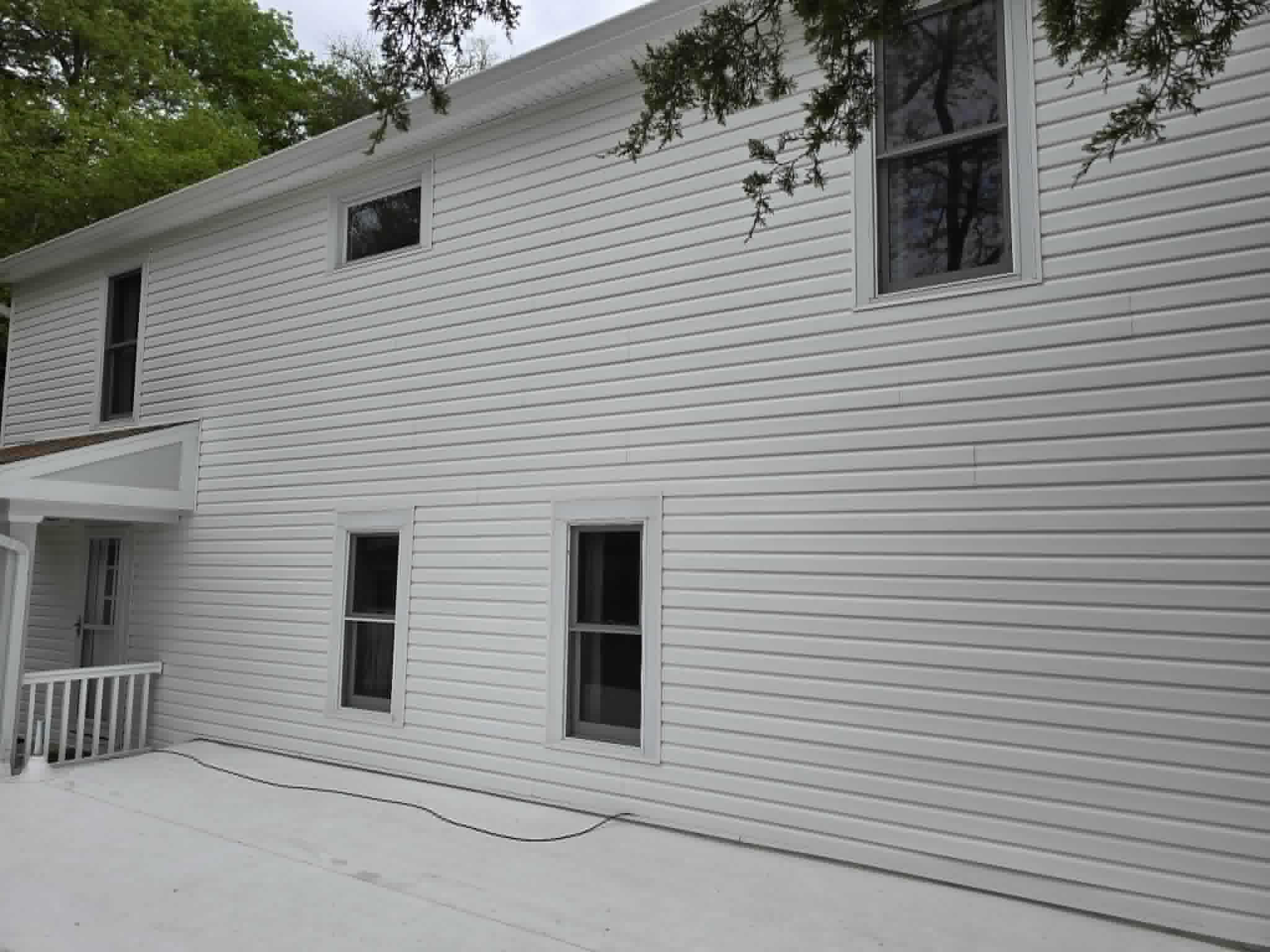 Wide view of house siding after soft wash house cleaning in Dayton Ohio